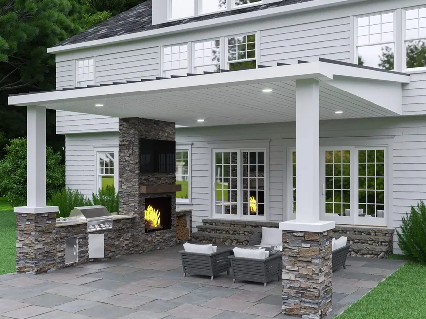 Covered stone patio with an outdoor fireplace and seating