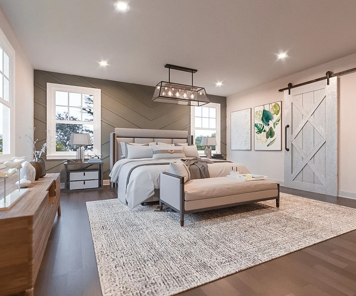 Bedroom with barn door and upholstered bed