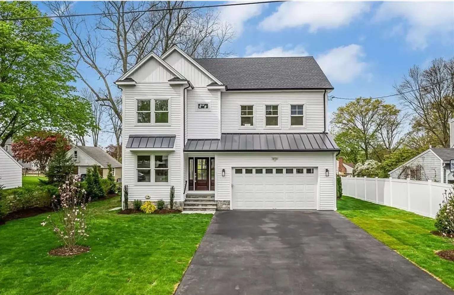 Finished two-story white home with garage