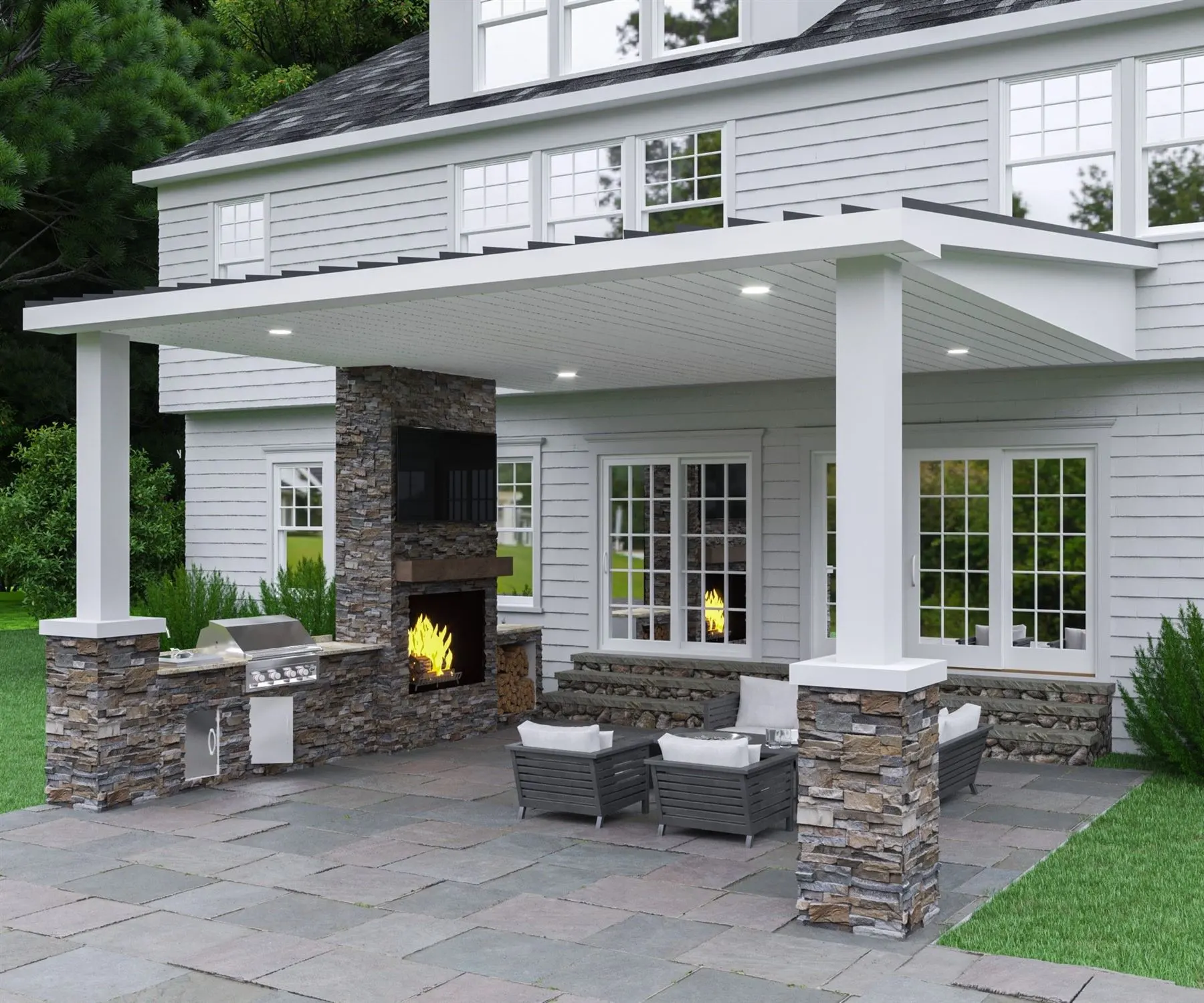 Covered stone patio with outdoor fireplace and seating