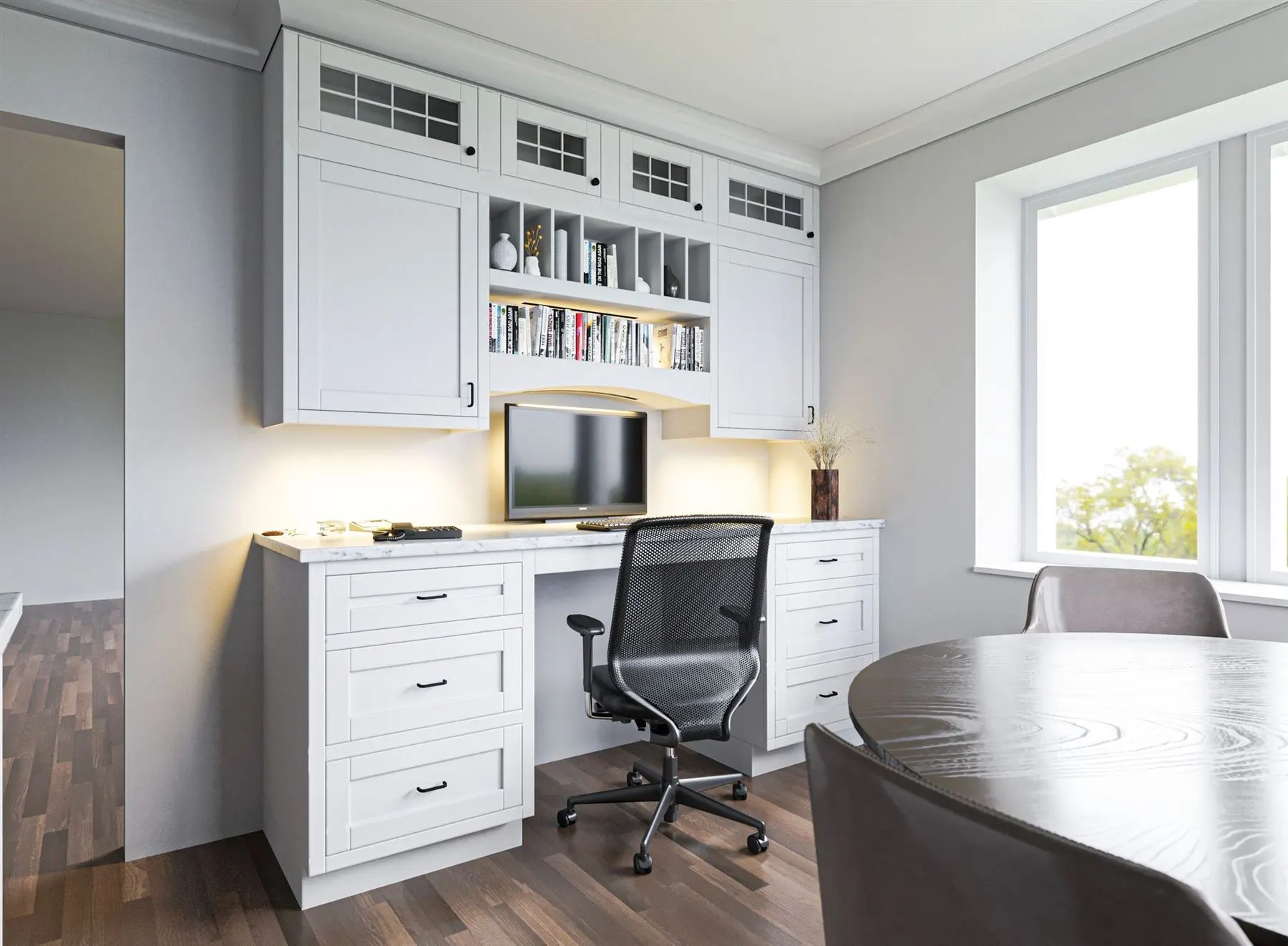 Home office with white built-in cabinets and shelving